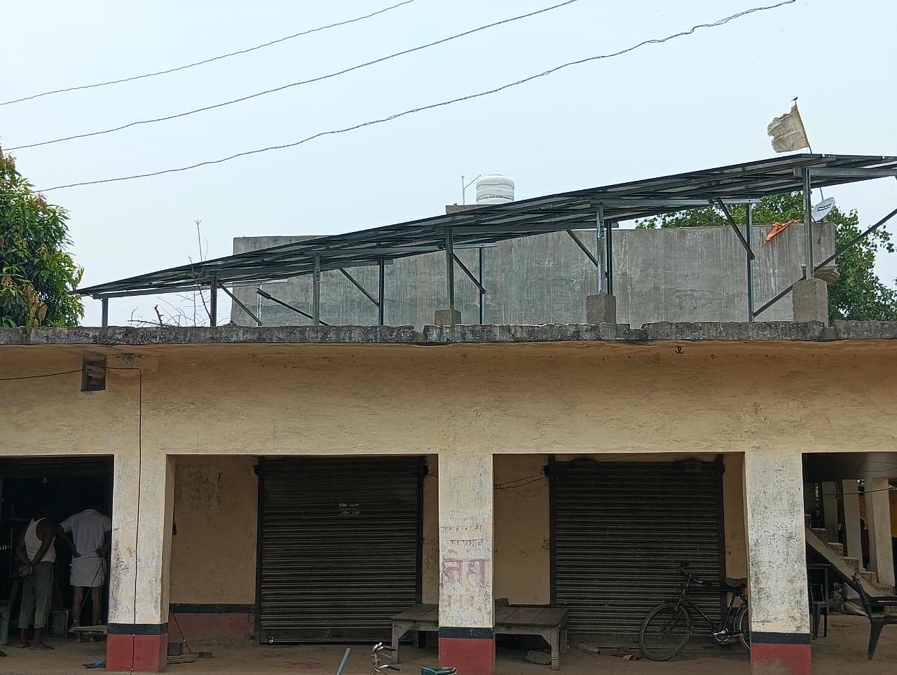 Street view of a shop building with rooftop solar installation